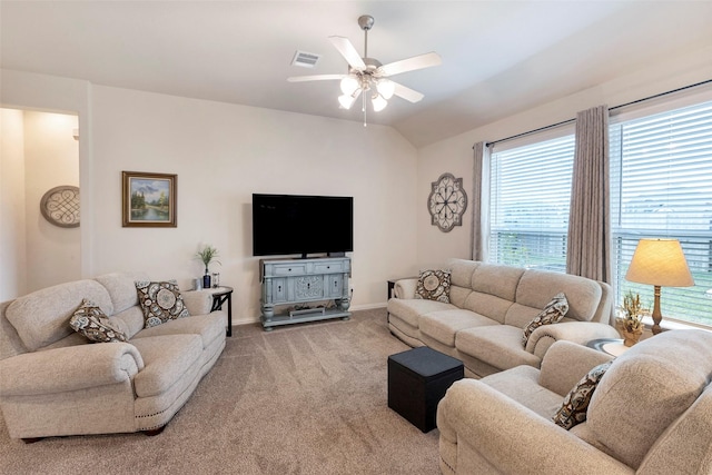 carpeted living room featuring ceiling fan and vaulted ceiling