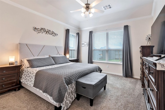 carpeted bedroom featuring ornamental molding and ceiling fan