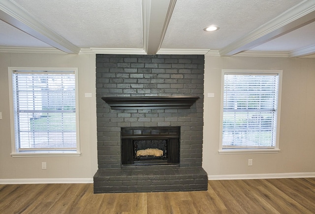 details with a brick fireplace, a textured ceiling, hardwood / wood-style floors, and beam ceiling