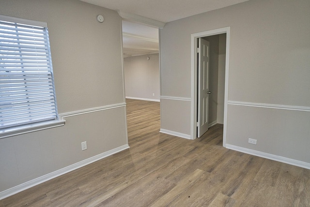 unfurnished room featuring hardwood / wood-style flooring