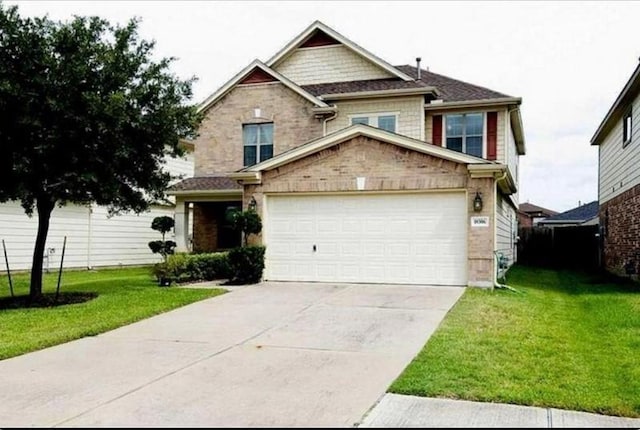 view of front of home featuring a front yard and a garage