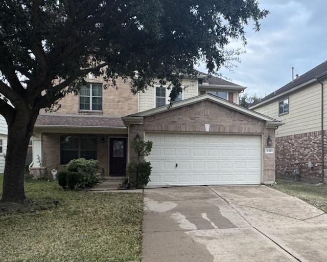 view of front of home with a front lawn and a garage