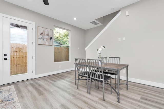 dining room with light wood-type flooring and ceiling fan