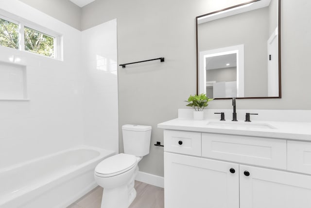 full bathroom featuring toilet, vanity, and shower / tub combination