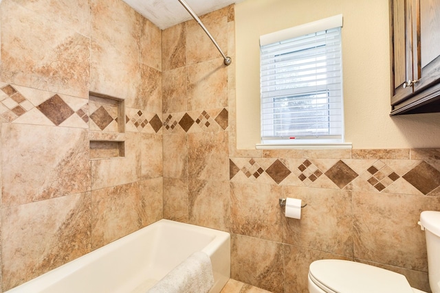 bathroom with tile walls and toilet