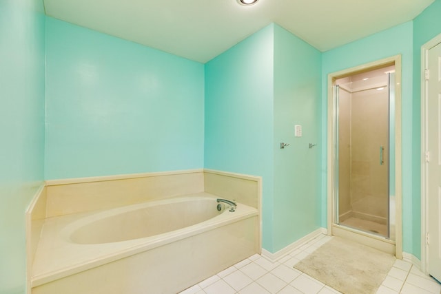 bathroom featuring tile patterned floors and plus walk in shower