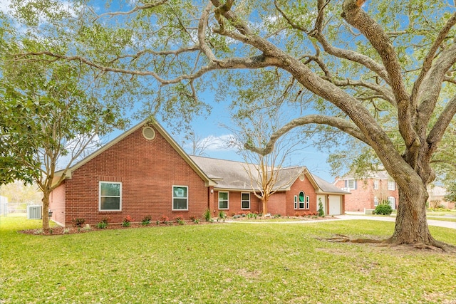 single story home featuring a front yard and a garage