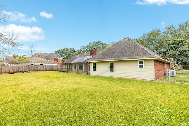 back of house featuring a yard