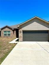 ranch-style home featuring a garage