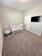 unfurnished bedroom featuring a closet and dark carpet