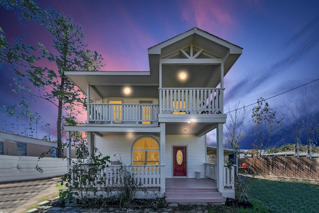 view of front of home featuring a porch and a balcony