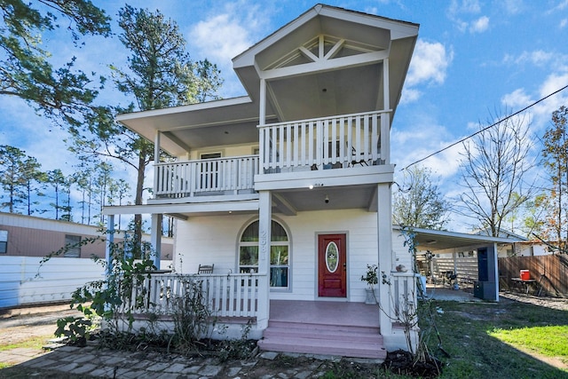 view of front of house featuring covered porch and a balcony