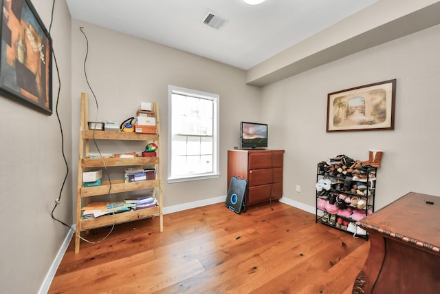 office with hardwood / wood-style flooring