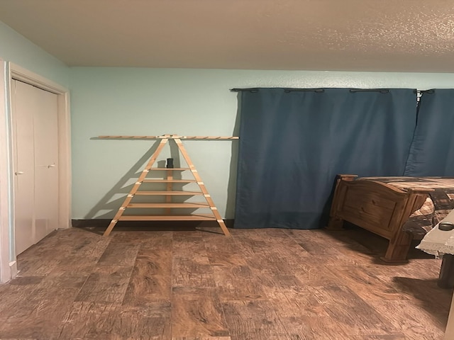 bedroom with dark wood-type flooring