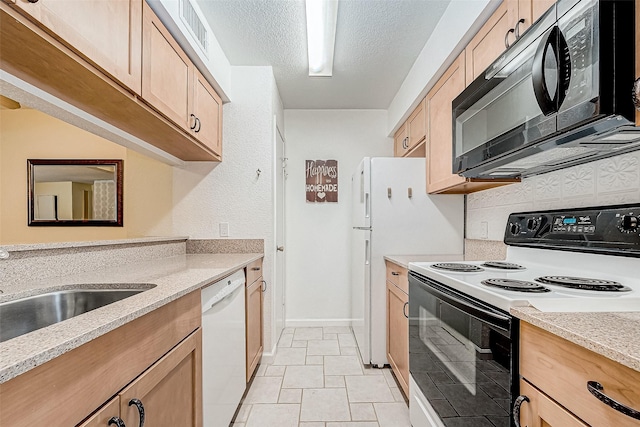 kitchen featuring light stone counters, a textured ceiling, white dishwasher, light tile patterned floors, and range with electric cooktop