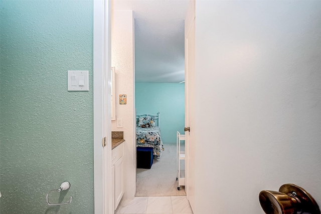 hallway featuring light tile patterned flooring