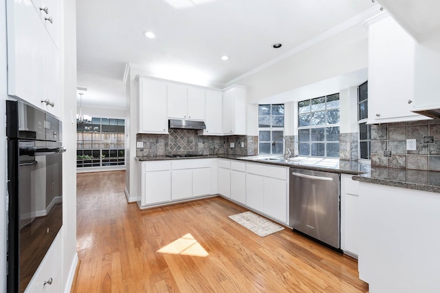 kitchen featuring black appliances, light wood-type flooring, white cabinets, and sink