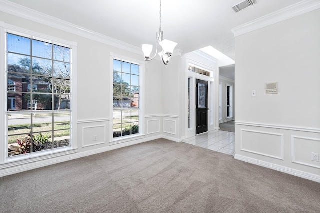 unfurnished dining area featuring an inviting chandelier, ornamental molding, and light colored carpet