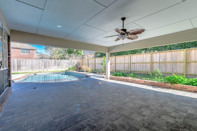 view of pool featuring a patio and ceiling fan