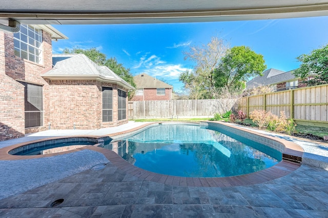 view of swimming pool with a patio