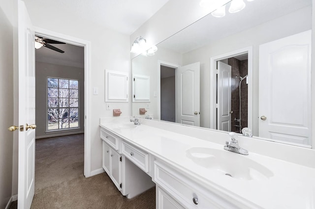 bathroom with ceiling fan, walk in shower, and vanity