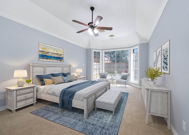 bedroom with vaulted ceiling, ornamental molding, ceiling fan, and light carpet