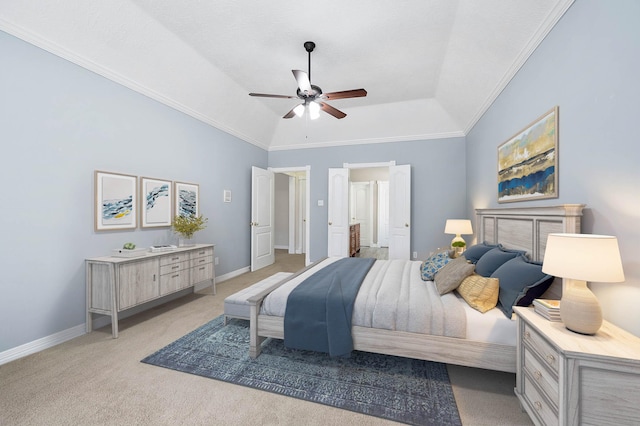 bedroom with vaulted ceiling, a raised ceiling, light colored carpet, ceiling fan, and ornamental molding