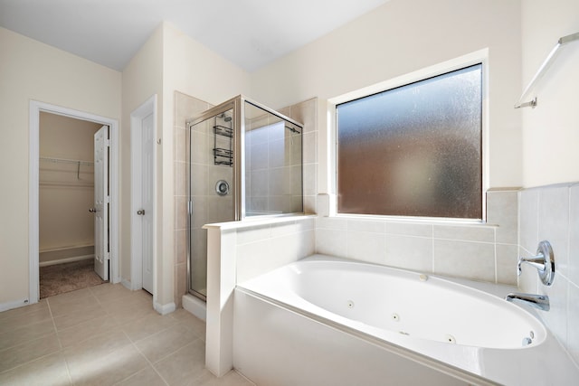 bathroom featuring tile patterned flooring and independent shower and bath