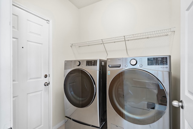 washroom featuring independent washer and dryer