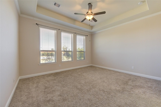 6611 Hollow Bay Ct, Katy, TX 77493 - spare room with a raised ceiling, carpet flooring, a ceiling fan, ornamental molding, and baseboards