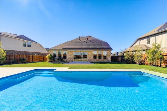 view of pool with a yard