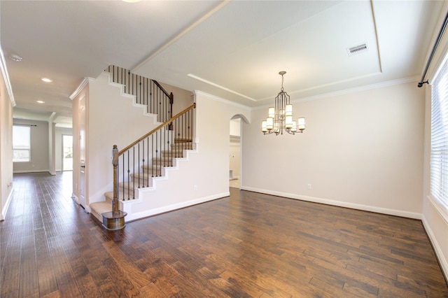 interior space with crown molding, dark hardwood / wood-style floors, and a chandelier