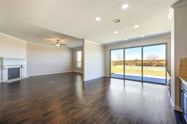 unfurnished living room with dark hardwood / wood-style flooring and ornamental molding