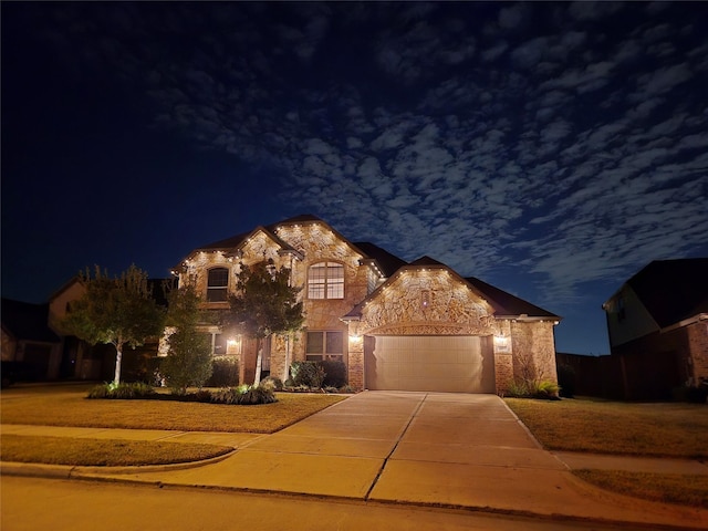 6611 Hollow Bay Ct, Katy, TX 77493 - view of front facade with concrete driveway, stone siding, and a garage