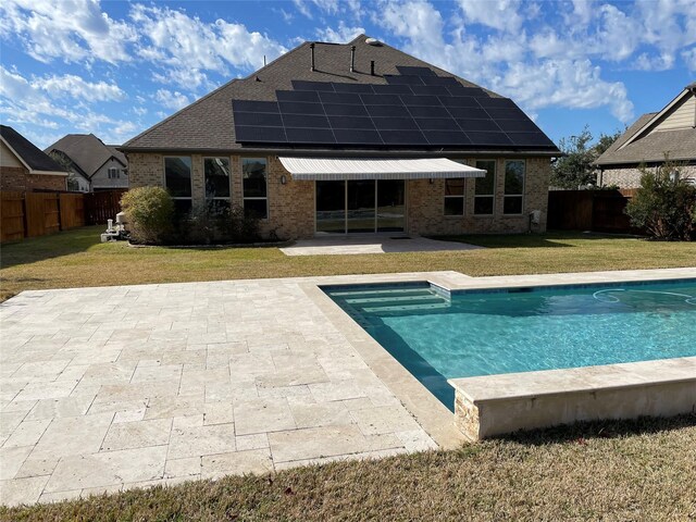 view of pool with a yard and a patio area