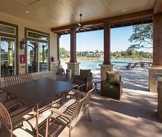 6611 Hollow Bay Ct, Katy, TX 77493 - view of patio with ceiling fan, outdoor dining area, and a pool