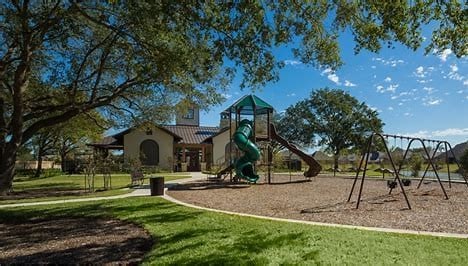 communal playground featuring a yard