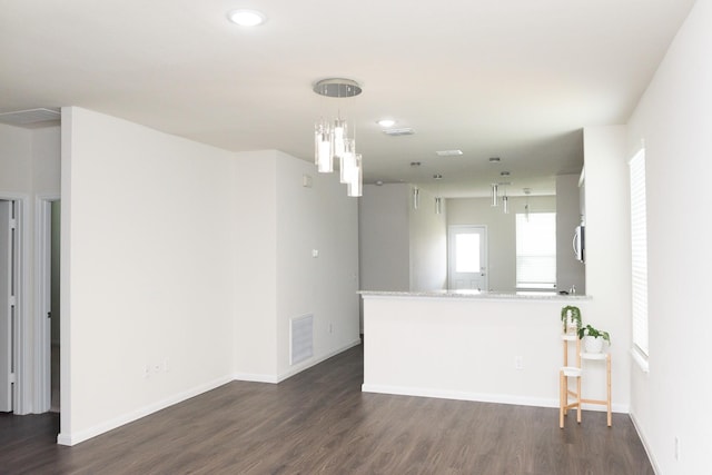 spare room featuring dark wood-type flooring