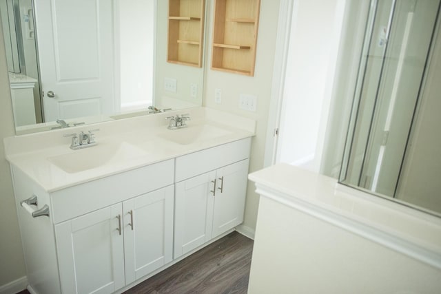 bathroom featuring vanity and hardwood / wood-style floors