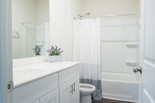 full bathroom with shower / tub combo, hardwood / wood-style floors, vanity, and toilet