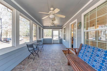 sunroom / solarium with ceiling fan