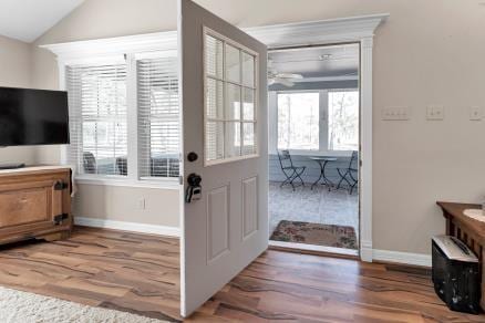 entryway featuring vaulted ceiling and hardwood / wood-style floors