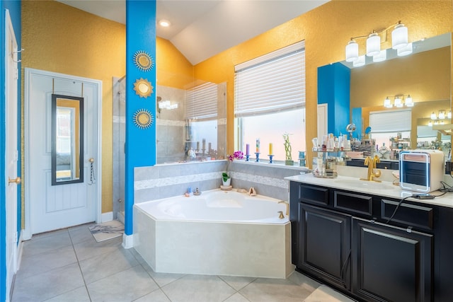 bathroom with vaulted ceiling, tile patterned flooring, plus walk in shower, and vanity