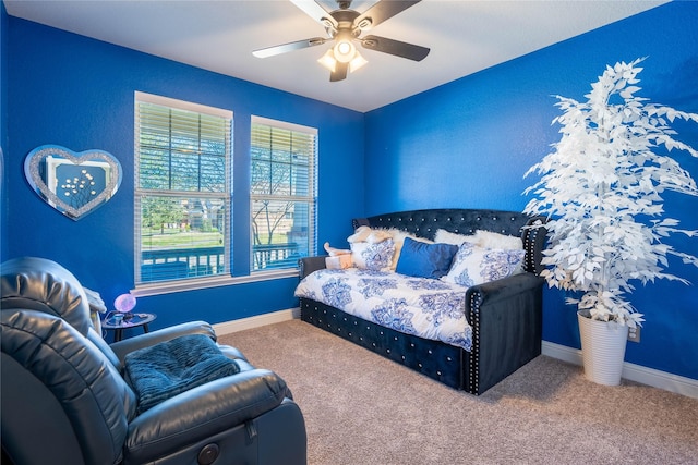 carpeted bedroom featuring ceiling fan