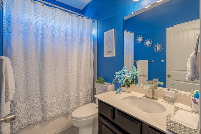 full bathroom featuring toilet, vanity, tile patterned floors, and shower / bath combo with shower curtain