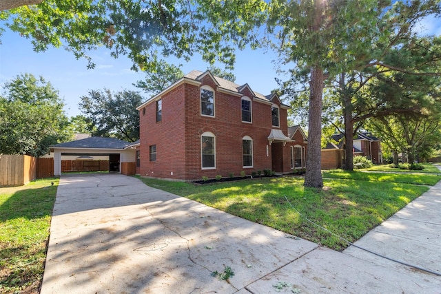 view of front facade featuring a carport and a front lawn