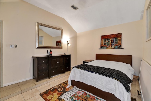 tiled bedroom with vaulted ceiling