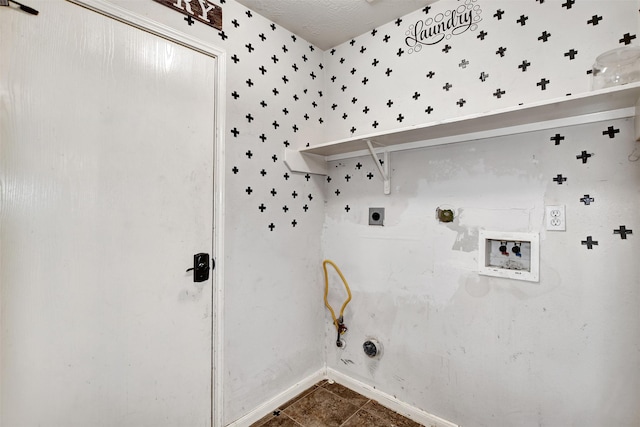 clothes washing area featuring dark tile patterned floors, washer hookup, hookup for a gas dryer, and hookup for an electric dryer