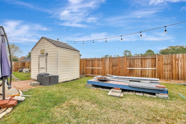 view of yard with a storage unit and a wooden deck