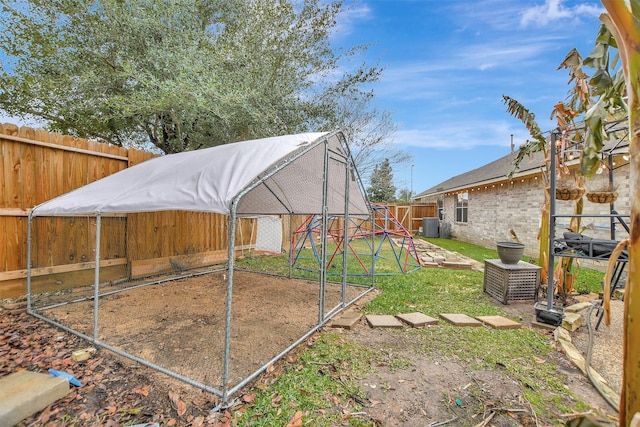 view of yard with central AC